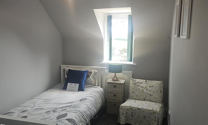 The Redford Cwtch Lounge – a cosy, welcoming space with soft seating, warm lighting, and rustic charm, perfect for relaxing with family or friends aft